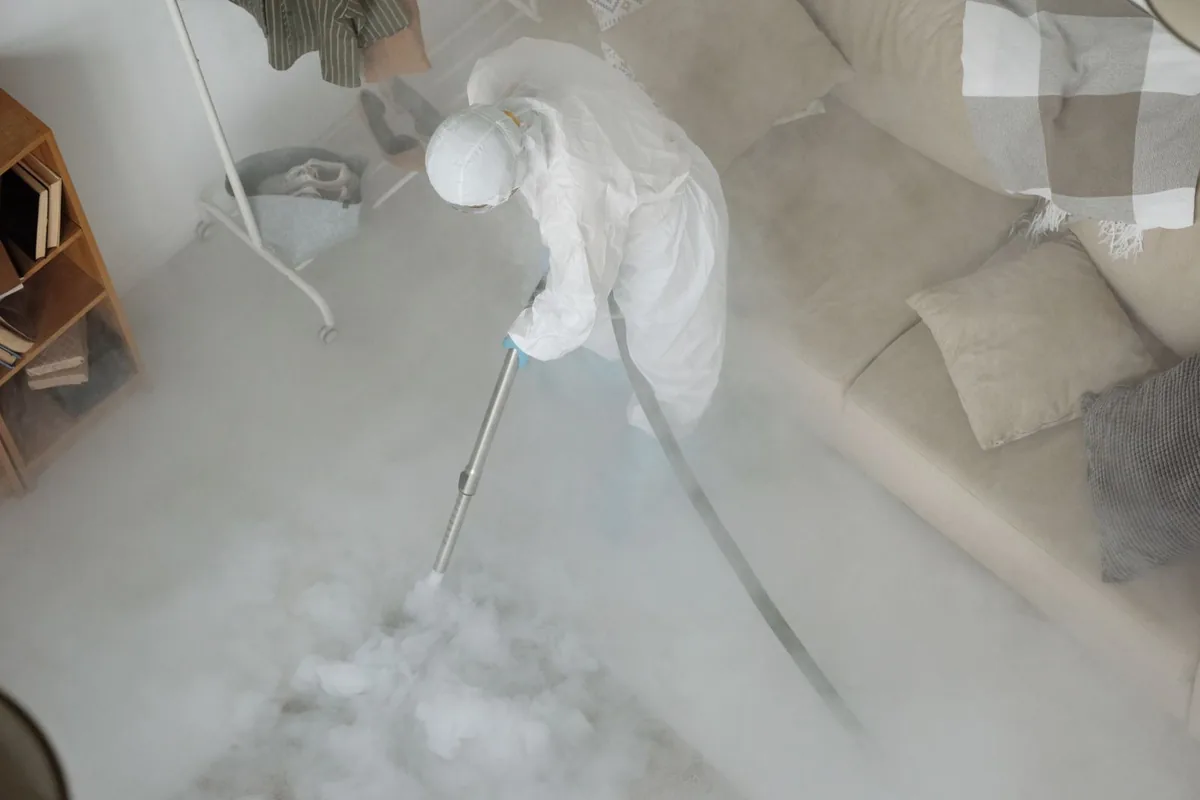 Biohazard cleanup technician in protective equipment, Midland City, AL